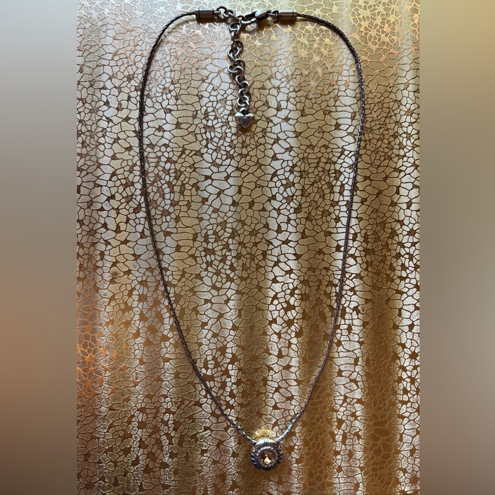 Brighton chain with champagne color pendant. There is a minor kink in the chain